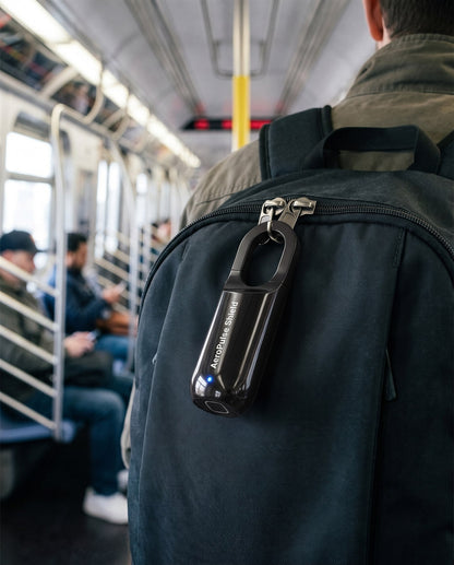 Black AeroPulse Shield locking the two zipper pulls of a backpack on a subway